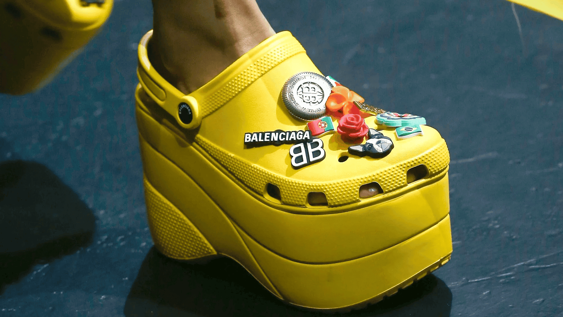 Yellow platform Crocs decorated with Balenciaga branding