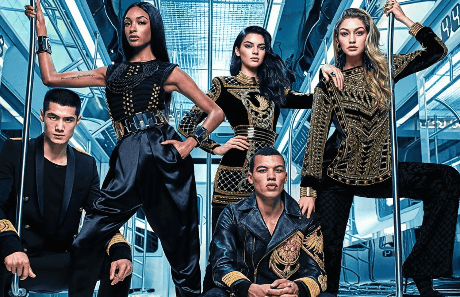 Models showcasing H&M x Balmain fashion collaboration